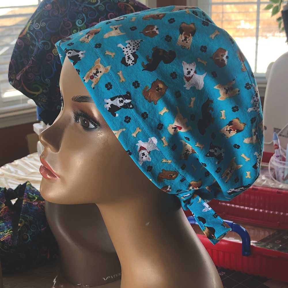 Puppies design scrub cap.